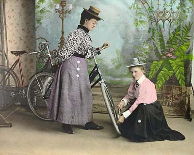 Misses Palmer and Severud and their wheels in Milton, North Dakota circa 1900.  Fred Hultstrand History in Pictures Collection, NDIRS-NDSU, Fargo, ND.  DIGITAL ID (hand-colored) ndfahult c445.  Gift of Donna Jean Verwest, 1969.  From The Northern Great Plains, 1880-1920: Photographs from the Fred Hultstrand and F.A. Pazandak Photograph Collections at the Library of Congress.