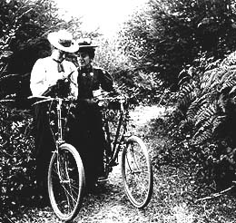 Two women on bicycles, Aug. 24, 1898.  Creator: William Holmes Wilcox.  Before the 1890s, bicycle design and long skirts kept most women from joining men in the new craze for cycling. It wasn't considered proper for a women to wear short skirts or show her legs. By 1895, a number of Seattle women were taking cycling classes and wearing baggy pants called bloomers as they cycled along the city's growing network of trails.  This August 1898 photo shows two women standing by their bicycles on a path near Port Townsend. It was taken by local photographer William H. Wilcox.  Picture ID# SHS 13,467.

Hyperlink to Museum of History and Industry.