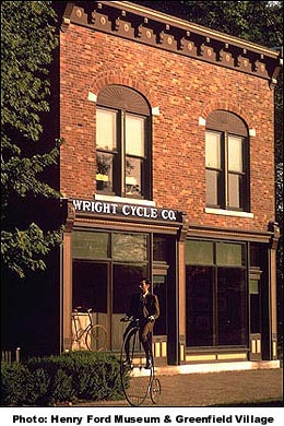 The Henry Ford Museum & Greenfield Village  acquired the Wright Brothers' Cycle Shop and their family home in 1936.  The are open to the public at the Dearborn, Michigan theme park.